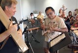 A happy Glenn Akemine of Volcano holds his newly-won ukulele