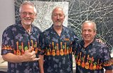 Mike Perdue (L), Roger Johnson and Terry Davis coordinated their exhibit apparel