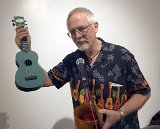 Mike Perdue raffles off an ukulele