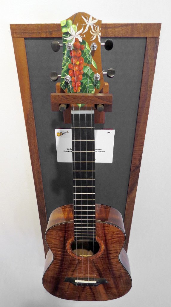 43 - Closeup of Woodley White's curly koa tenor ukulele with hand-painted headstock by Louis Daniele