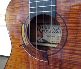 41 Closeup of the intarsia style rosette of mixed woods on Woodley White's curly koa tenor ukulele