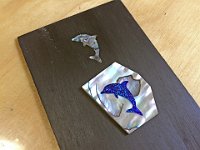 06 - Dolphin sticker on Dave Stokes' headstock veneer